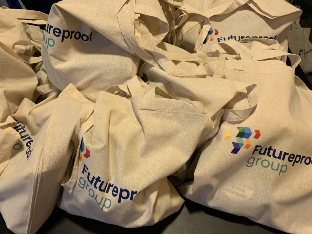a stack of goodie bags from futureproof group